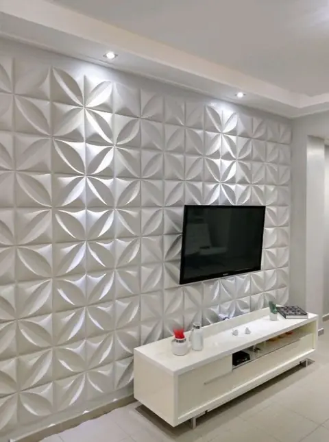 Parede 3D em gesso atrás da TV